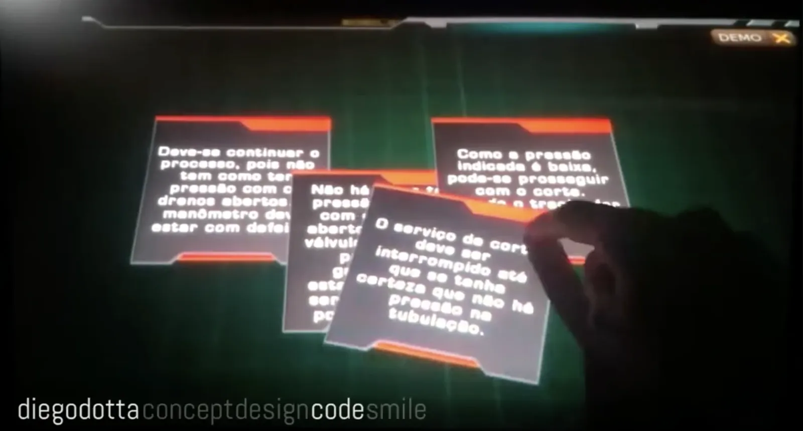 A hand dragging and rotating cards of Portuguese text across a dark touchscreen interface marked DEMO